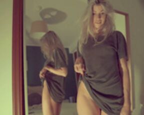 Ocicat nude in front of the mirror