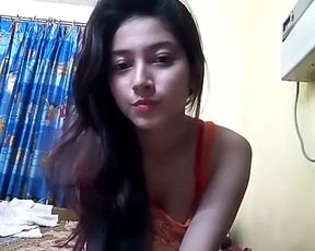Young girl getting naked in front of camera